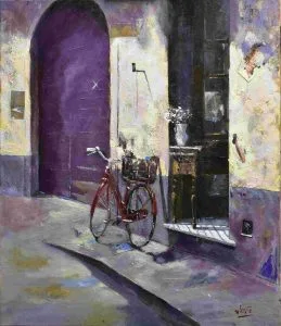 Bicicleta roja y jarron con flores